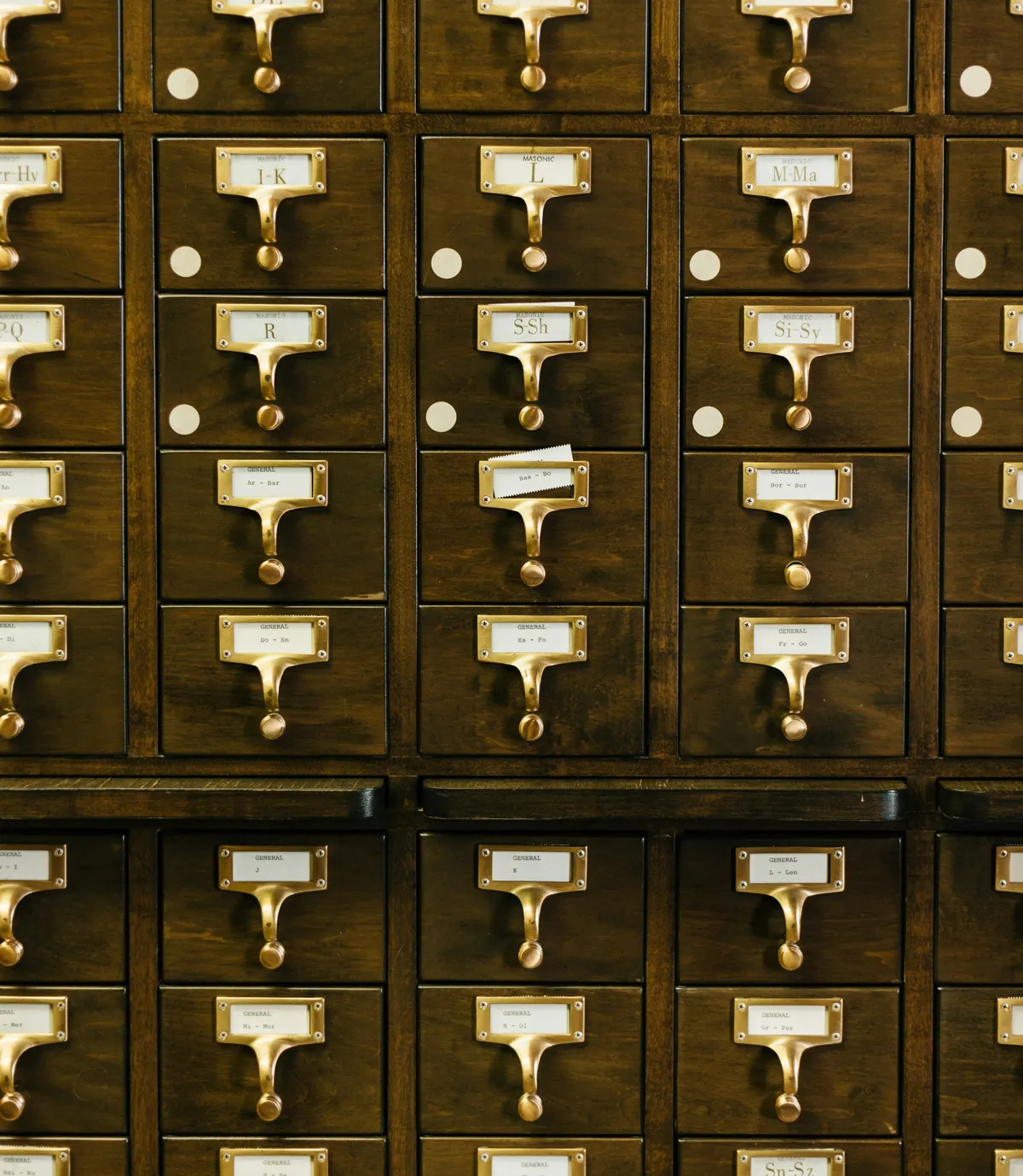 Wooden card index drawers with brass label holders